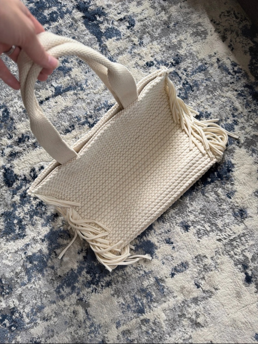 Antik Kraft cream/ivory woven tote bag featuring long fringe